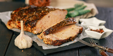 Food banner. Sliced delicious homemade cold boiled pork with spices. Pork appetizer for Christmas table.