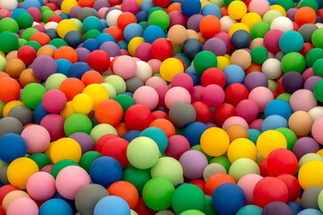 Fototapeta na wymiar Ball Pit Pool with rainbow colors plastic balls for children to play. Dry pool