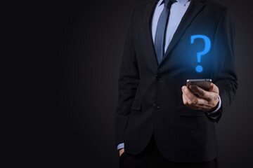 Businessman man hand hold interface question marks sign web. Ask quiestion online, FAQ concept, what where when how and why, search information on internet