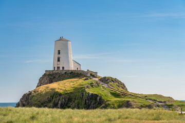 Fototapeta na wymiar Ty Mawr Lighthouse on Llanddwyn Island in North Wales
