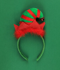 christmas elf headband isolated on green background