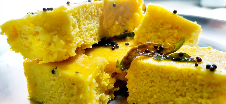 Closup shot of gujarati Khaman Dhokla or Steamed Gram Flour Snack