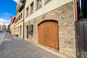 Fototapeta na wymiar Front door of a rustic wine cellar. Traditional architecture of Rothenburg ob der Tauber at Spitalgasse street 
