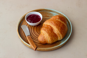 Croissant with cranberry jam. Breakfast. Vegetarian food. Pastries.