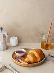 Croissant with cranberry jam. Breakfast. Vegetarian food. Pastries.