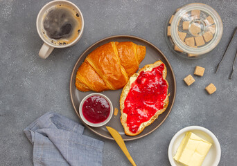 Croissant with cranberry jam and butter. Breakfast. Vegetarian food. Pastries.