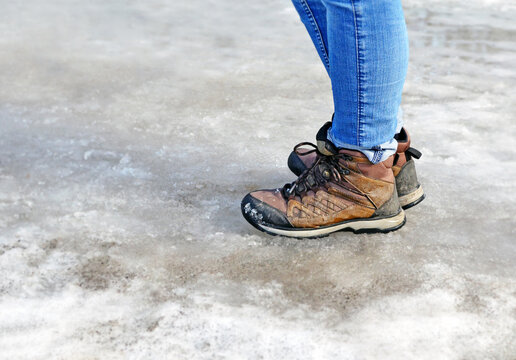 Legs In Wet Boots On Melting Snow I