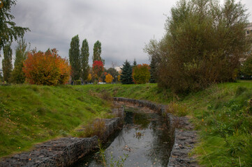 Moscow Park in autumn colorful trees river leaves in the water autumn 2017 Butovo