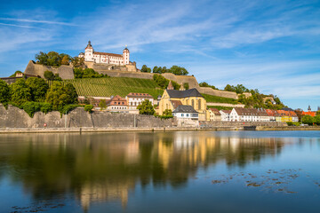 Fototapeta premium Marienberg Fortress reflecting in the river Main.colorful sunset. Wurzburg, Bavaria, Germany