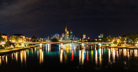 Fototapeta na wymiar Frankfurt city skyline illuminated at night. Germany