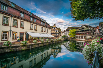 Old town water canal of Strasbourg, Alsace, France. Traditional half timbered houses of Petite France at dawn