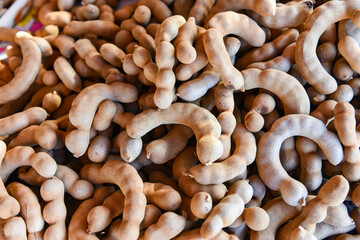tamarind for sale in the market fruit, fresh tamarind texture background.