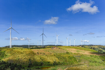 wind turbine landscape natural energy green Eco power concept at wind turbines farm blue sky background.