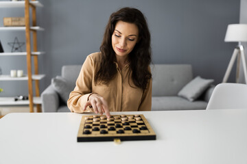 Woman Playing Checkers Online