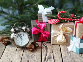 Christmas background and decoration with fir branches, gift boxes on old wooden board with copy space.Merry Christmas.