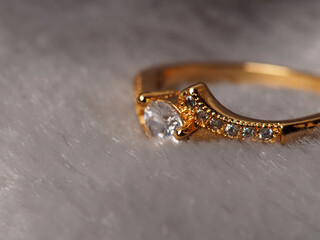 Close up shoot of gold ring with beautiful diamond, isolated on white