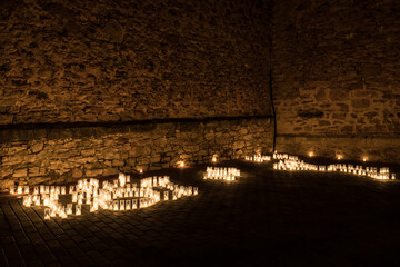 Titaguas village, streets illuminated by candles drawing shapes on the night of the candles celebration local july festival at Valencia Spain