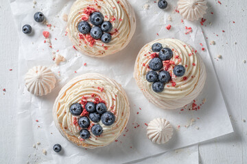 Crunchy mini Pavlova with whipped cream and fresh fruit