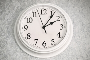 White clock hangs on the wall