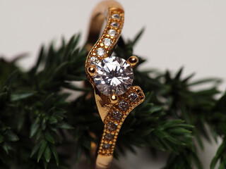 Close up shoot of gold ring with beautiful diamond, isolated on white