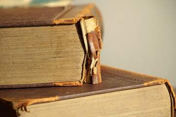 Damaged hardcover book prepared for repair and bookbinding