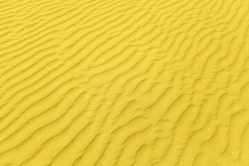 closeup of sand pattern of a beach. Illuminating and Ultimate gray Pantone color of the year 2021
