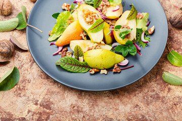 Healthy vegetarian salad with pear.