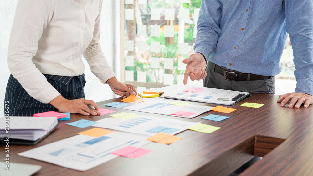Poster businessman stick colorful notes to brainstorming on the table working on new project to share idea 