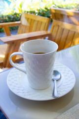 white glass of coffee in coffee shop