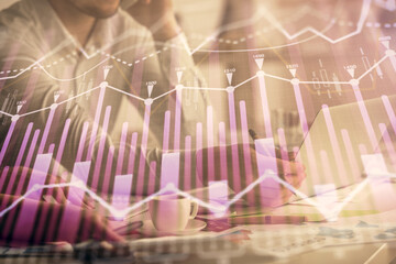 Multi exposure of man and woman working together and financial chart hologram. Business concept. Computer background.