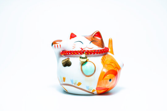  Lucky cat money box statue, isolated on a white background.