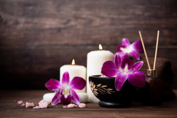 Obraz na płótnie Canvas Thai Spa Treatments aroma therapy salt and nature sugar scrub massage with orchid flower with candle. Thailand. Healthy Concept.