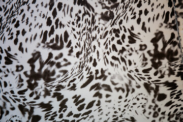Black and white abstract camouflage. The concealment pattern on a fabric. Conception of winter masking.