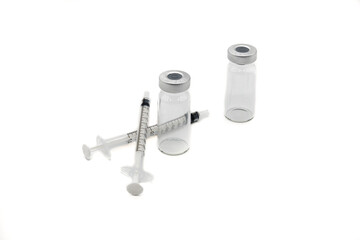 Two Medical Vaccine Syringes and Two Medical Ampules on a white background