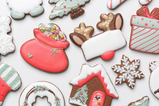 A Big Group Of Beautiflly Decorated Gingerbread Cookies On  White Background. Tasty Homemade Christmas Cookies Close Up View Directly Above.