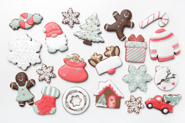 A big group of beautiflly decorated gingerbread cookies on  white background. Tasty homemade Christmas cookies close up view directly above.