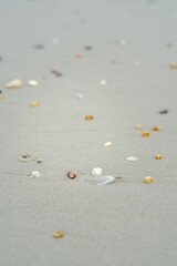 unique stones lie on a sandy background, selective focus with blur.