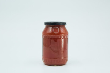 Canned tomato paste in a glass jar. Home canning. Long-term food