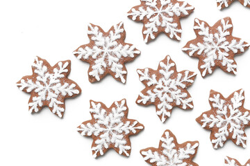 Star shaped gingerbread cookies on white background.