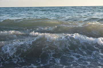 Fototapeta premium waves on the sea and yellow sky