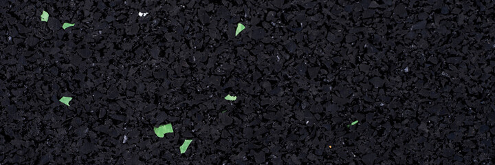 Panoramic texture of black foam rubber, close-up. Panorama