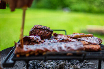 barbeque meat preparation in a summer day