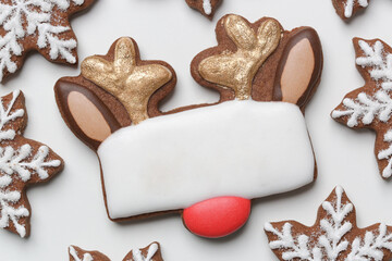 Christmas gingerbread cookies. Biscuits in reindeer and snowflake shapes. Close up, top view.