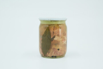 Canned meat in a glass jar. Home canning.