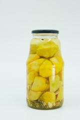 Canned zucchini and squash in a glass jar. Home canning.