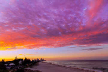 Colourful sunset sky, view from Miami hill lookout with Surfers Paradise Gold Coast cityscape in the horizon