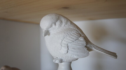 Souvenir bird on the shelf, interior item
