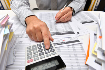 business concept - businessman working with reports in office, table and workspace close view,...