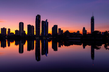 Fototapeta na wymiar Surfers Paradise cityscape reflection, with colourful sunrise sky. Gold Coast, Australia