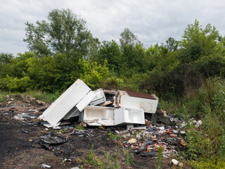 White goods wild dump, trash arson, negative ecological impact, ecosystem damage, neglect of...